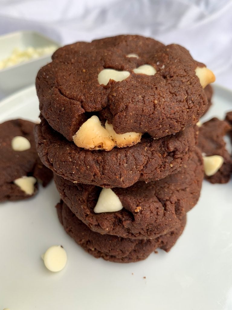 a stack of White Chocolate Chip Brownie Cookies on a white plate