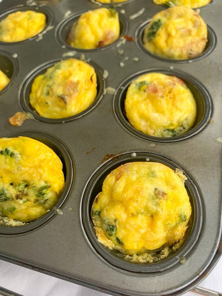 ham, swiss, and broccoli egg bites in the muffin tin
