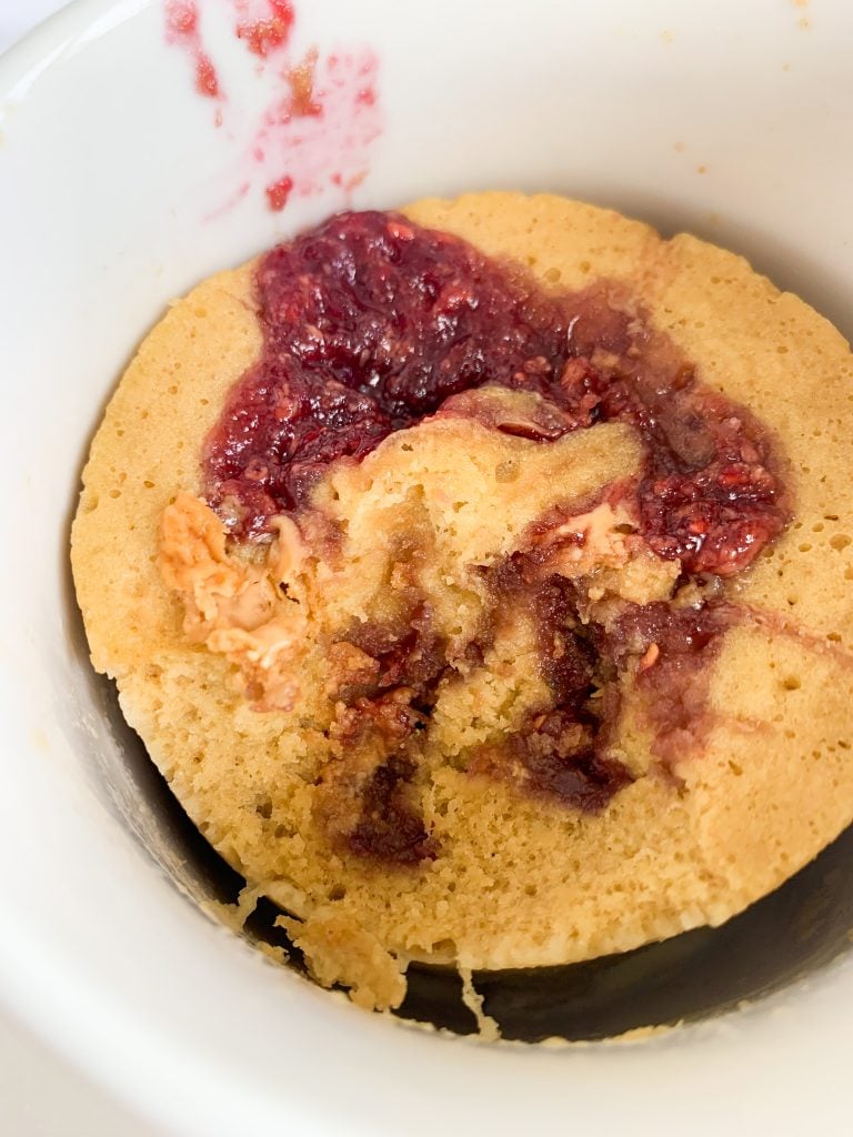 the mug cake with a bite taken out
