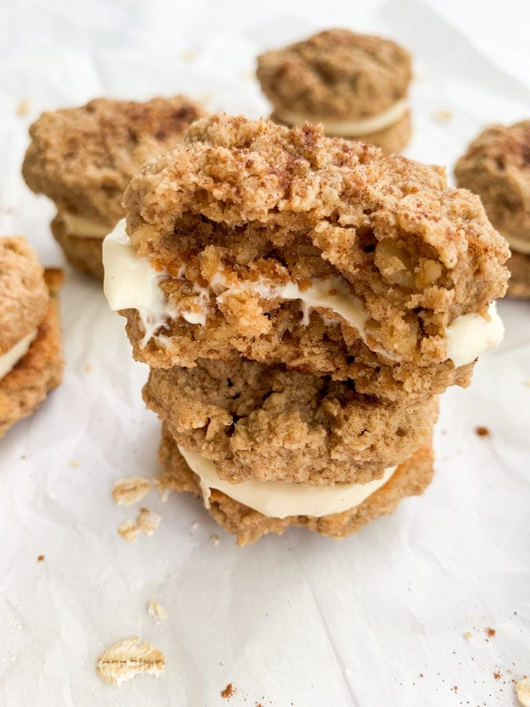 a stack of two oatmeal cookie sandwiches with cream cheese filling