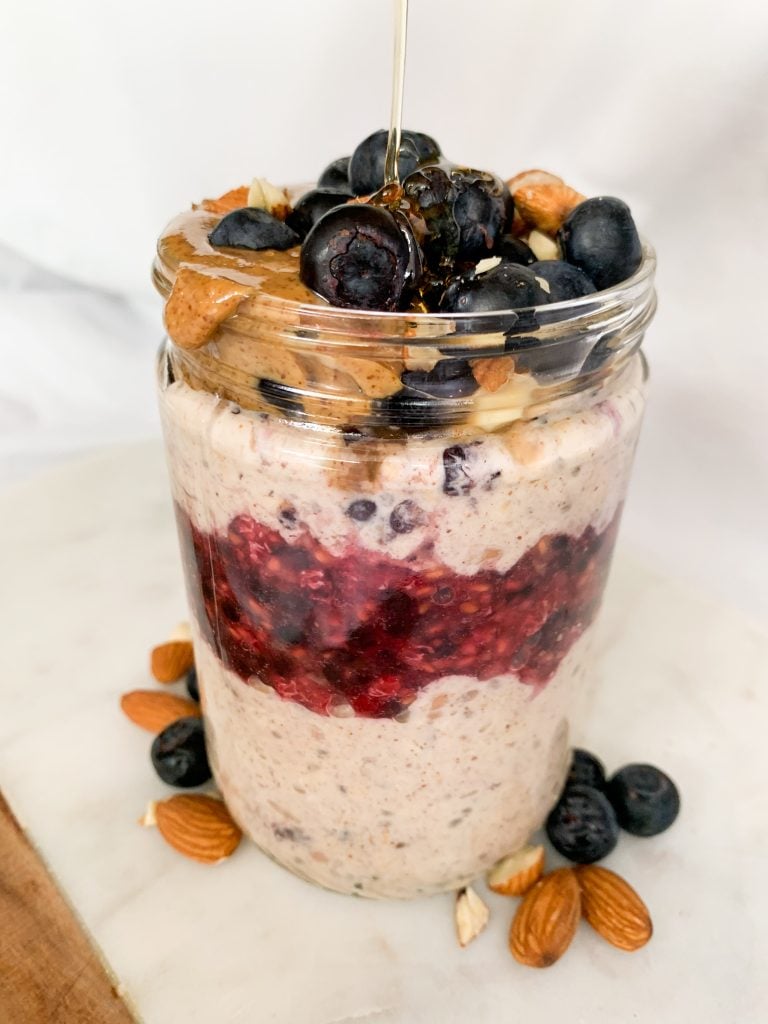 overnight oats in a jar with a honey pour