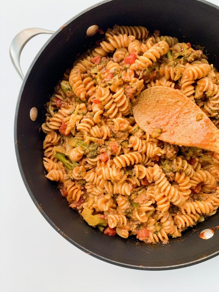 family favorite one pot pasta with a wooden spoon