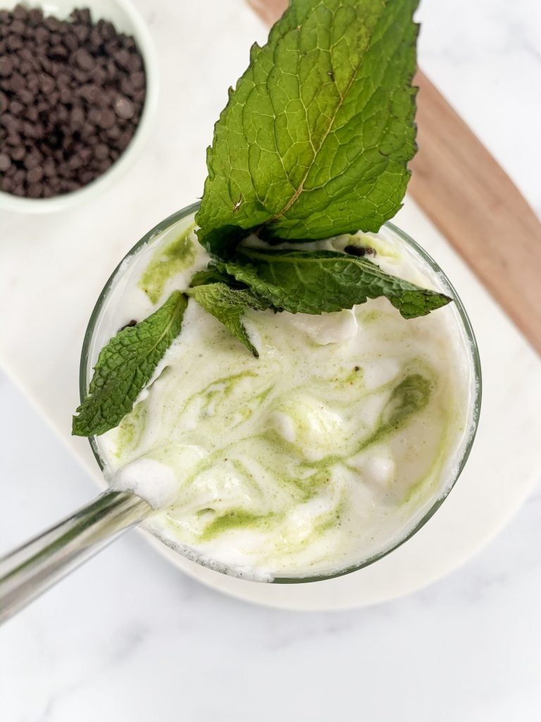 overhead shot of a healthy mint chocolate chip smoothie after it has been mixed