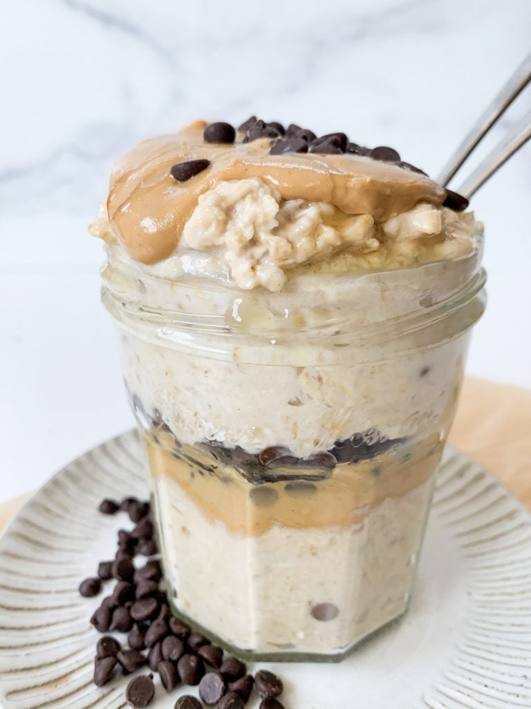 layered jar of oats with chocolate chips and cashew butter
