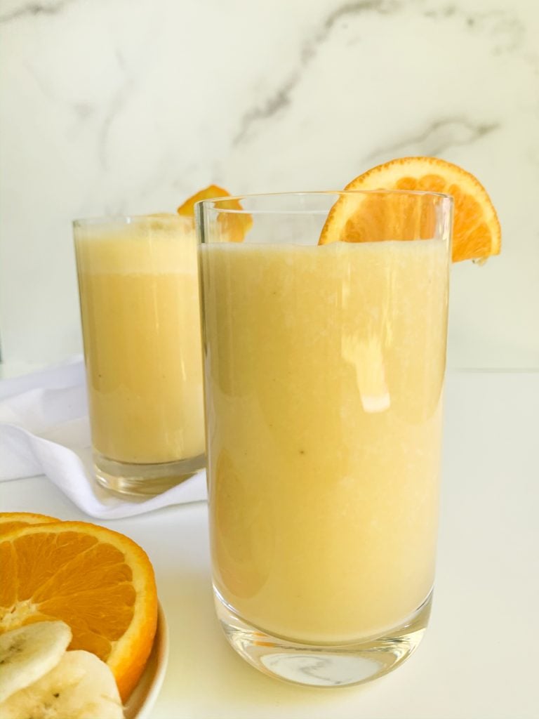 two glasses of orange creamsicle smoothie