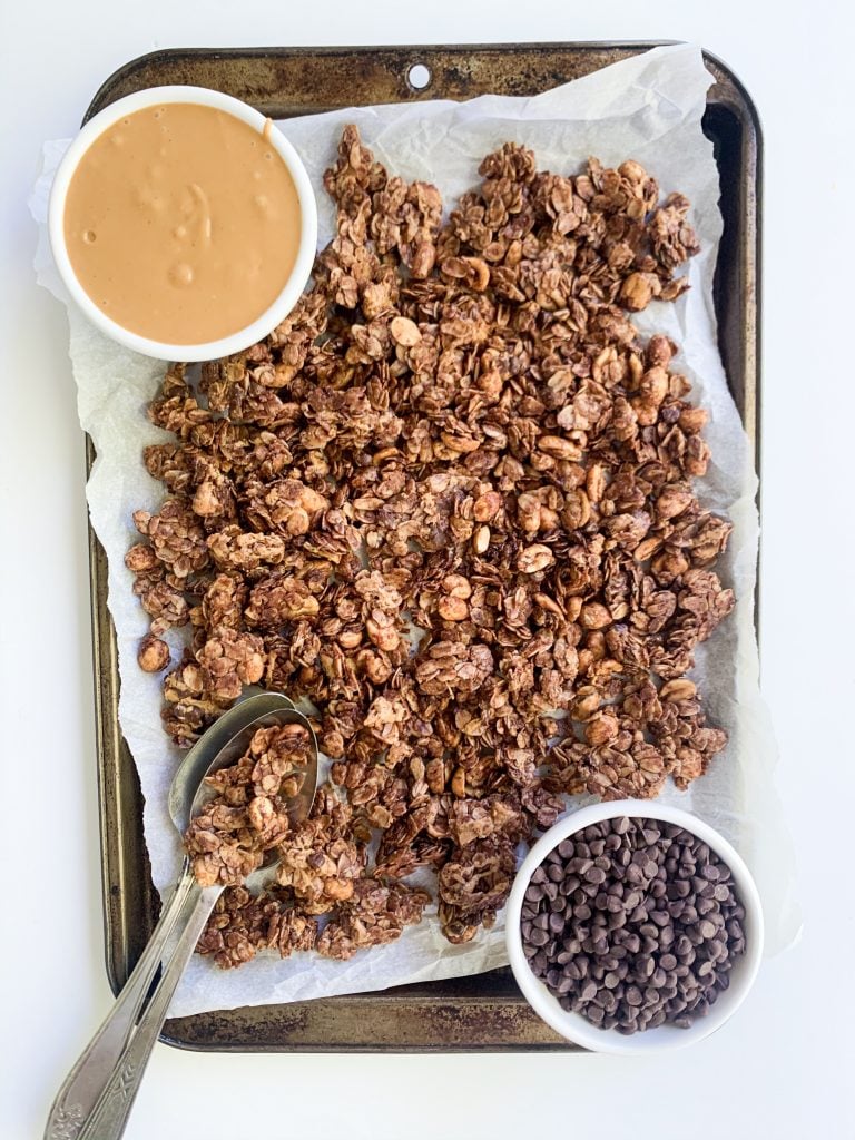 chocolate peanut butter granola on a baking tray