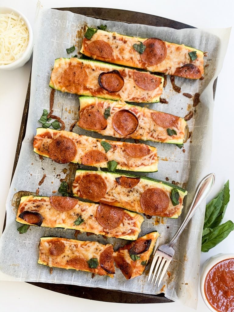 zucchini pizza boats on a baking tray
