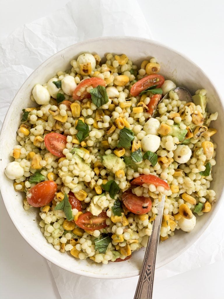 couscous salad recipe in a bowl with a spoon