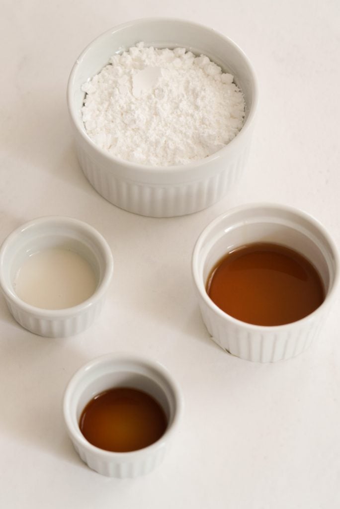 maple glaze ingredients measured out on a white surface