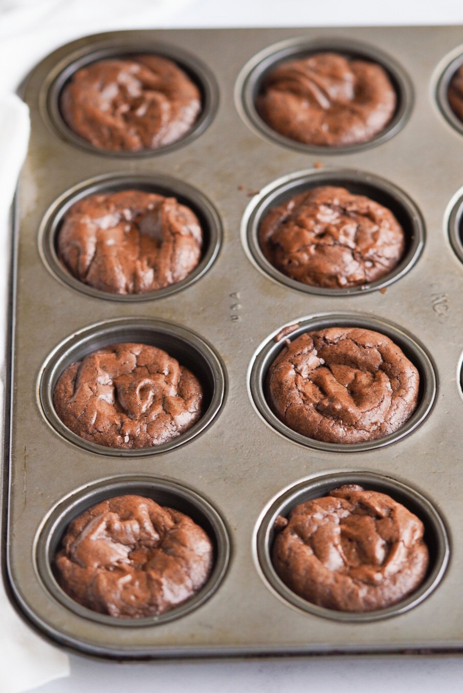 brownie bites in a muffin pan after baking