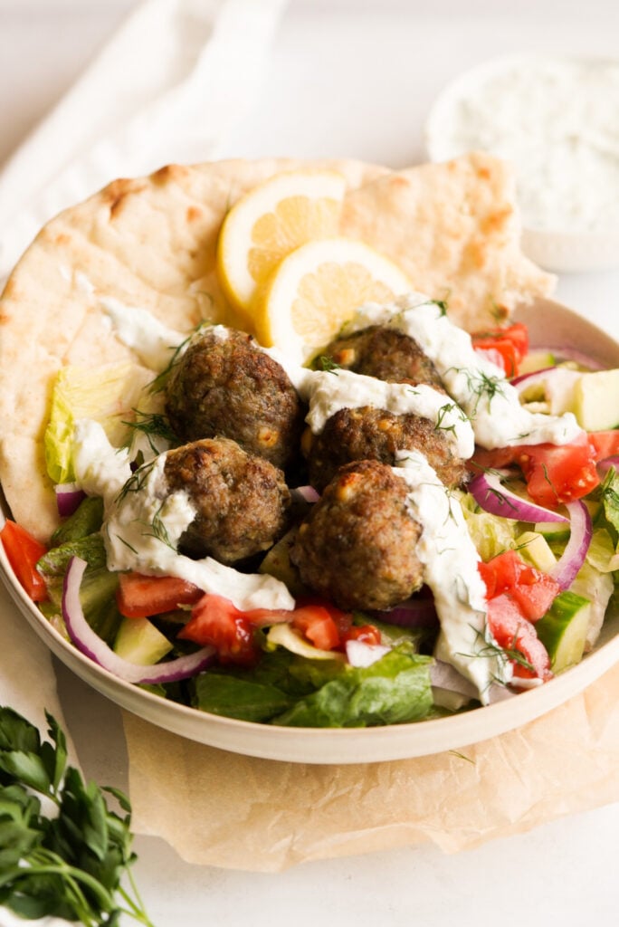 greek lamb & feta meatballs with a greek salad, pita bread, and tzatziki sauce