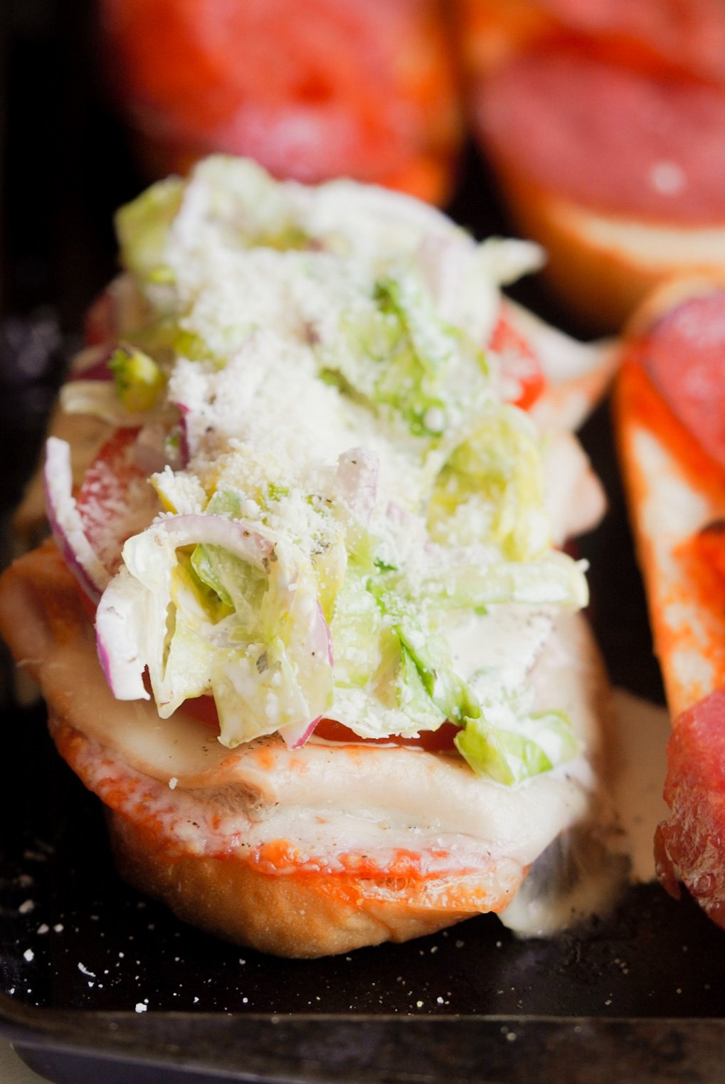 open viral grinder sandwich with salad