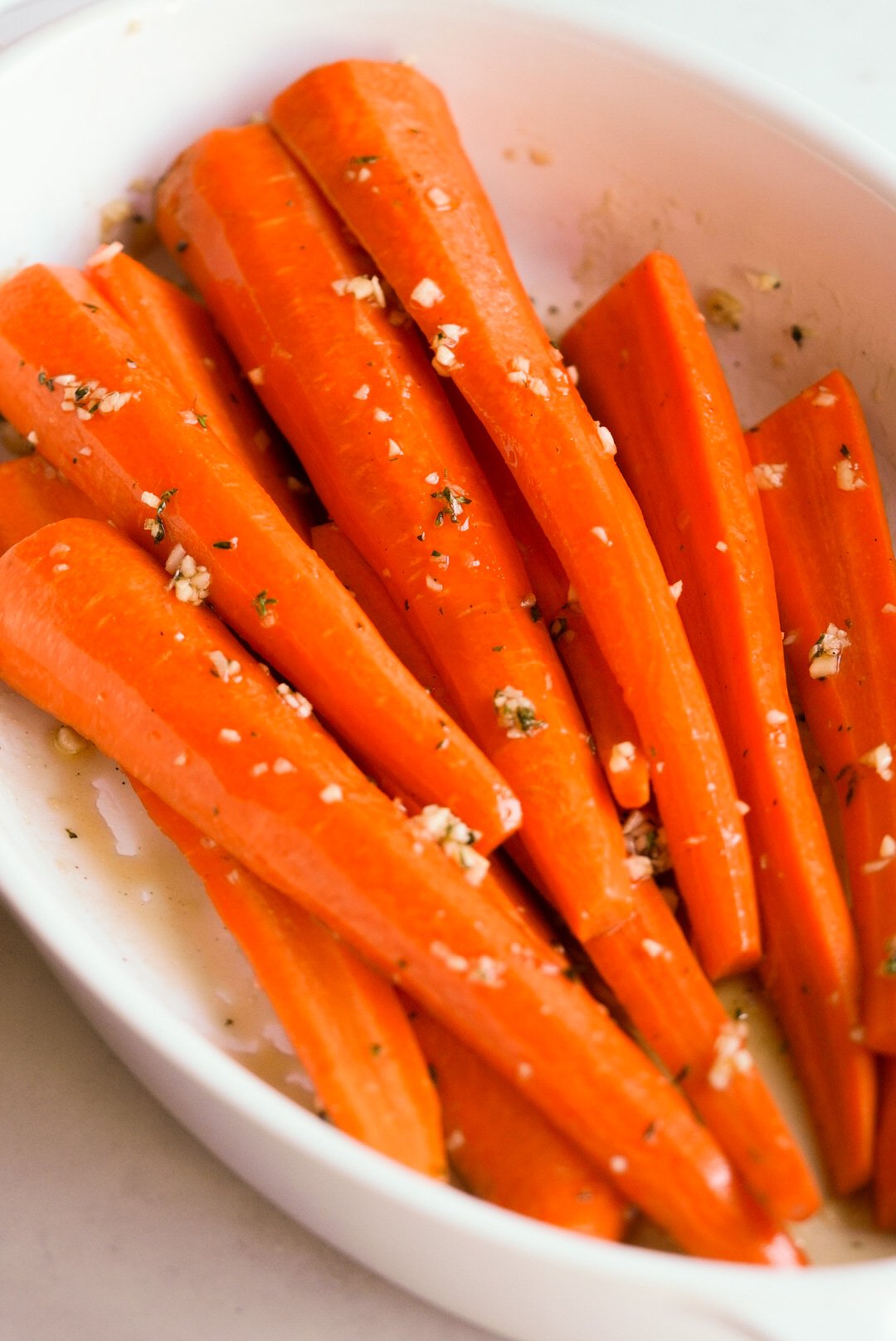 carrots in a baking dish covered with maple glaze
