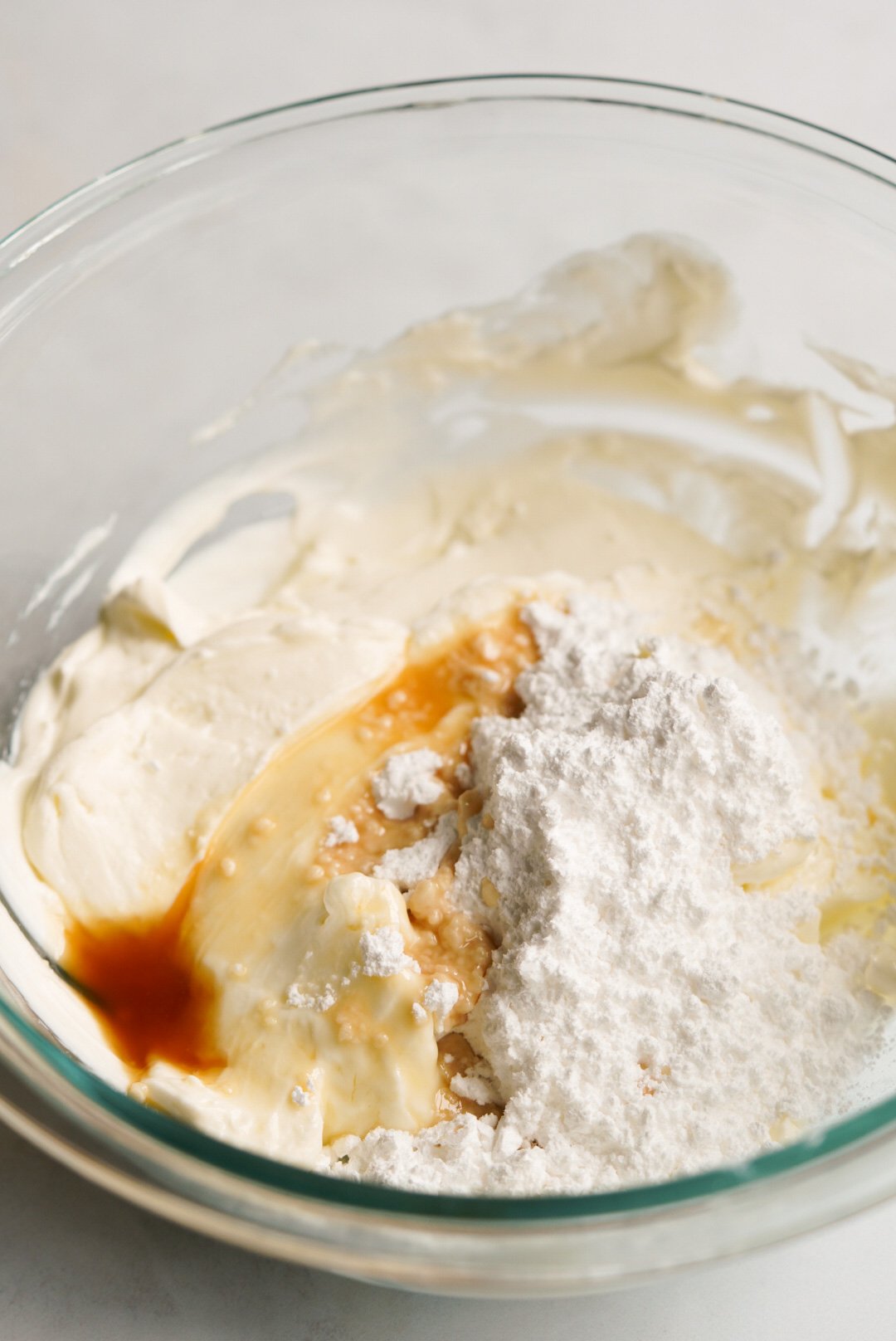 cream cheese, powdered sugar, and vanilla extract in a large bowl
