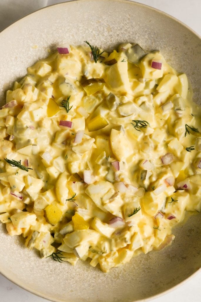 egg salad with dill pickles, red onion, and fresh dill