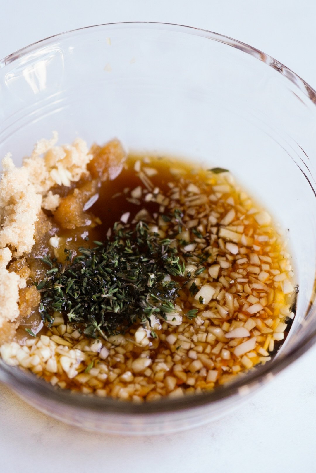maple syrup, brown sugar, thyme, and garlic in a small bowl
