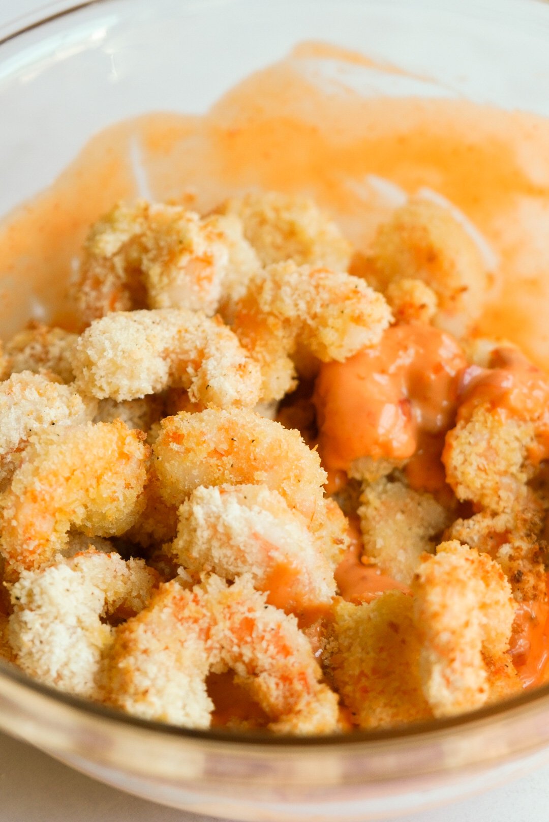 ai fried shrimp in a bowl with bang bang sauce