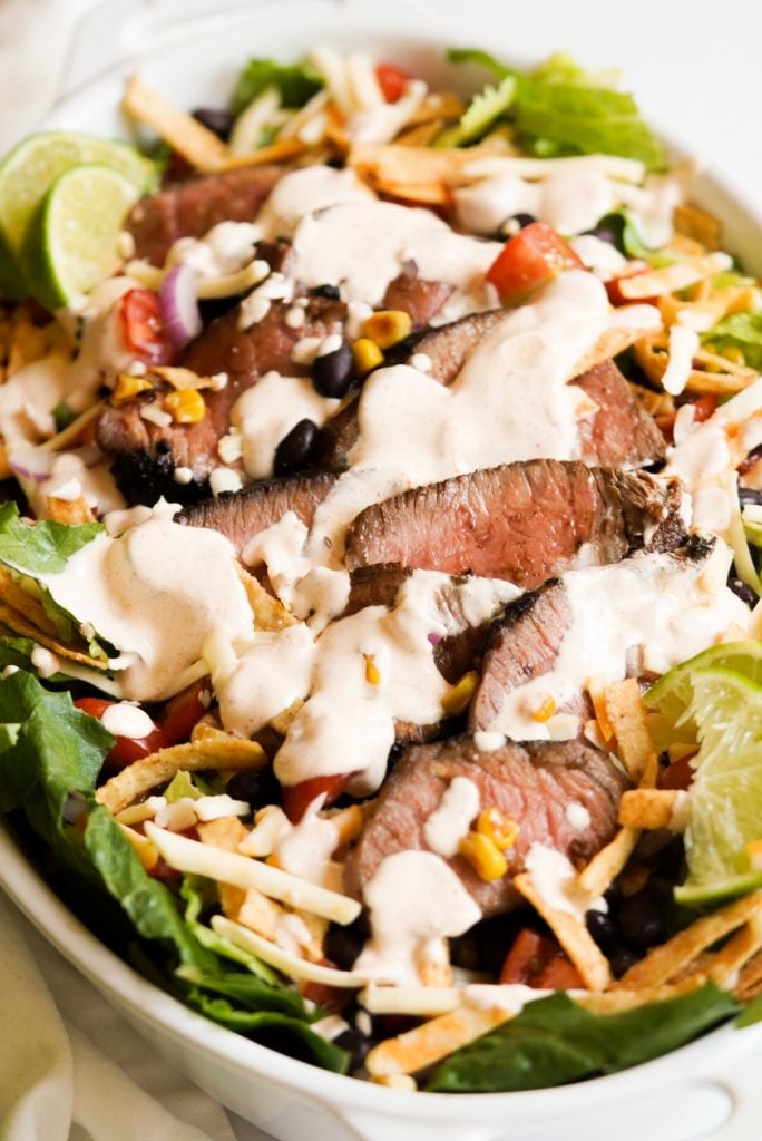 taco steak salad with creamy lime dressing