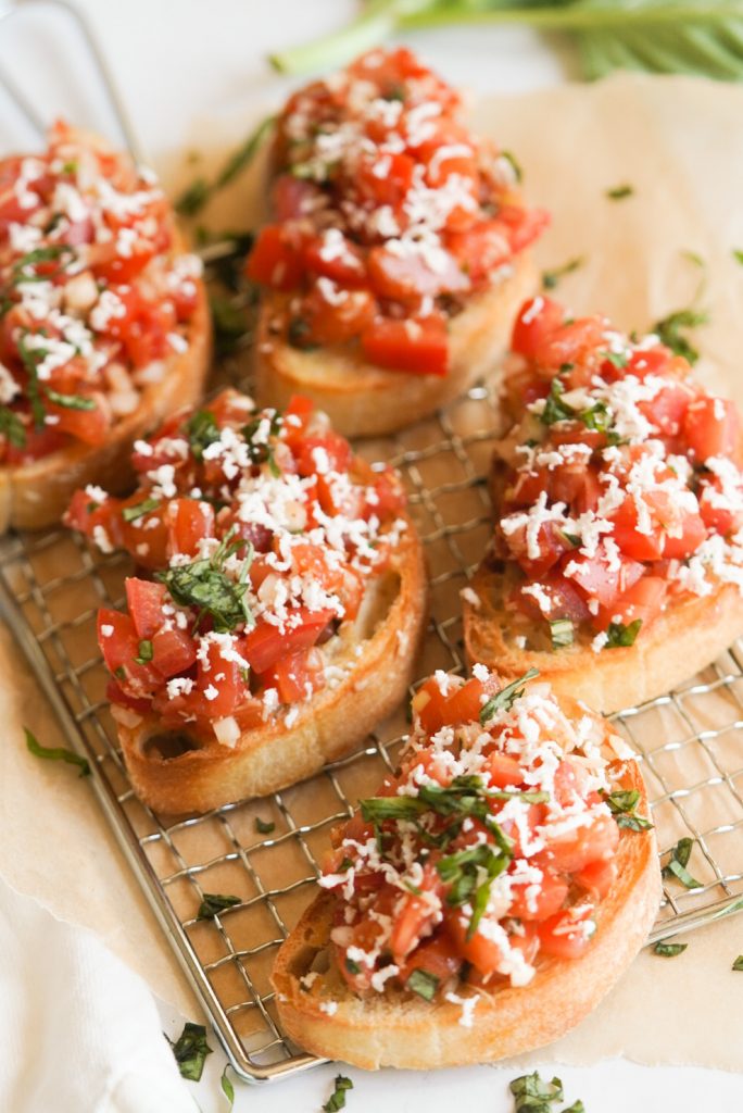 bruschetta on a tray on parchment paper
