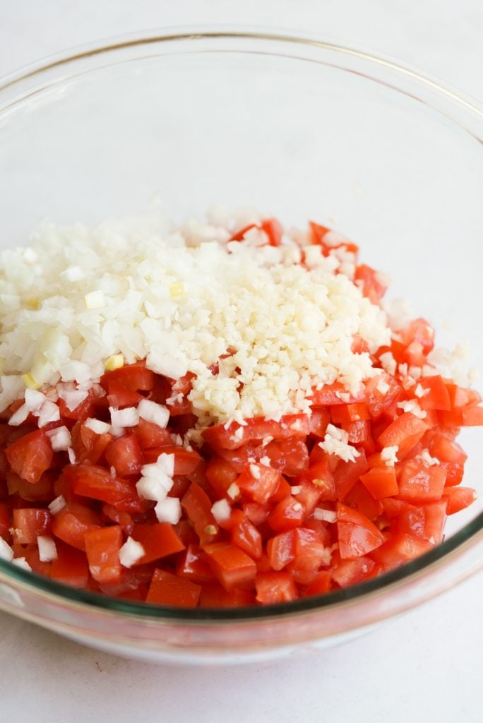 tomato, onion, and garlic in a bowl