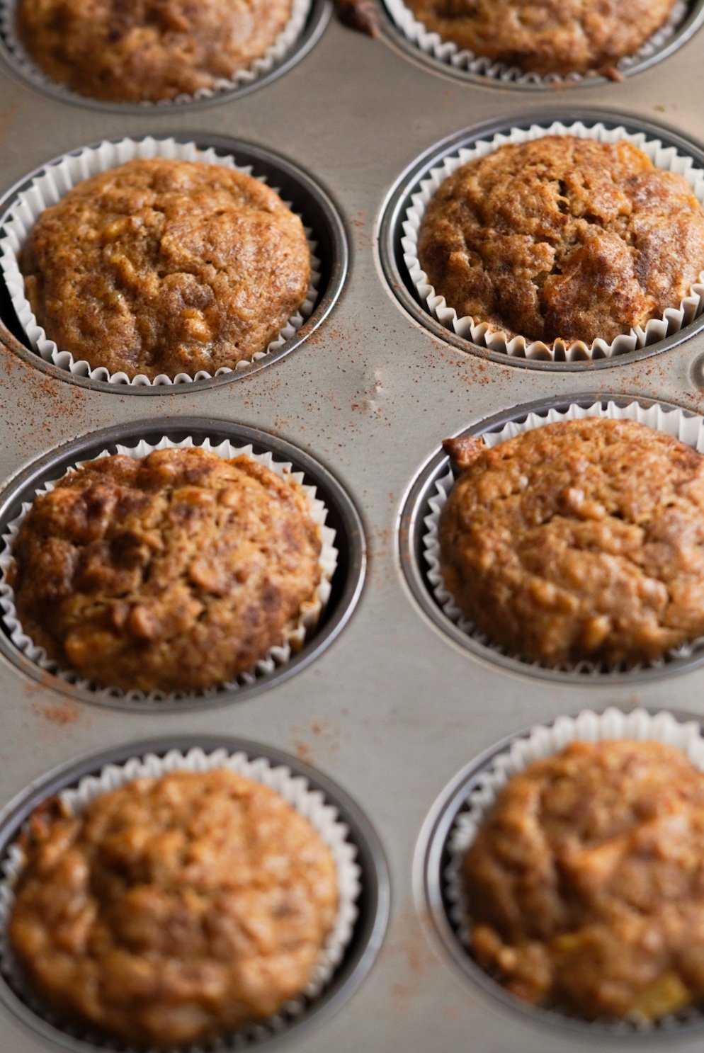 baked apple banana muffins in muffin pan
