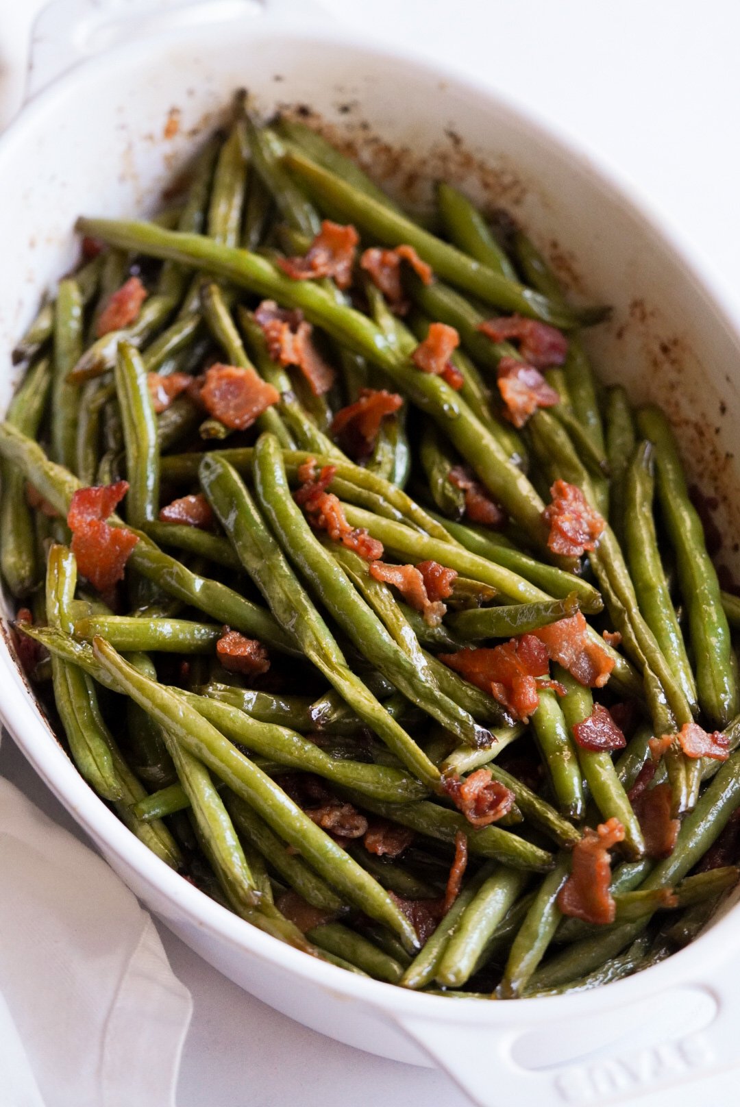 baked crack green beans in a casserole dish