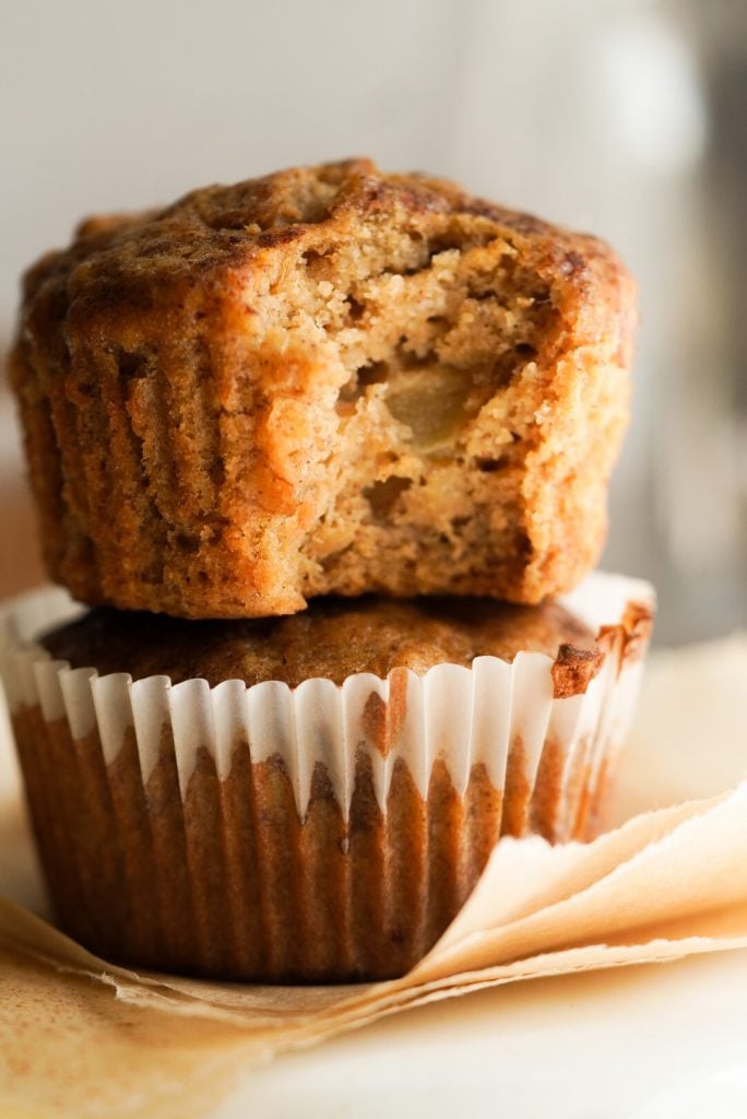 stack of two fall muffins with banana, apple, and cinnamon