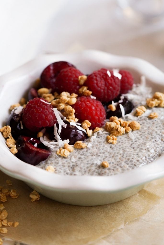 chia seed pudding with oat milk and toppings in a bowl
