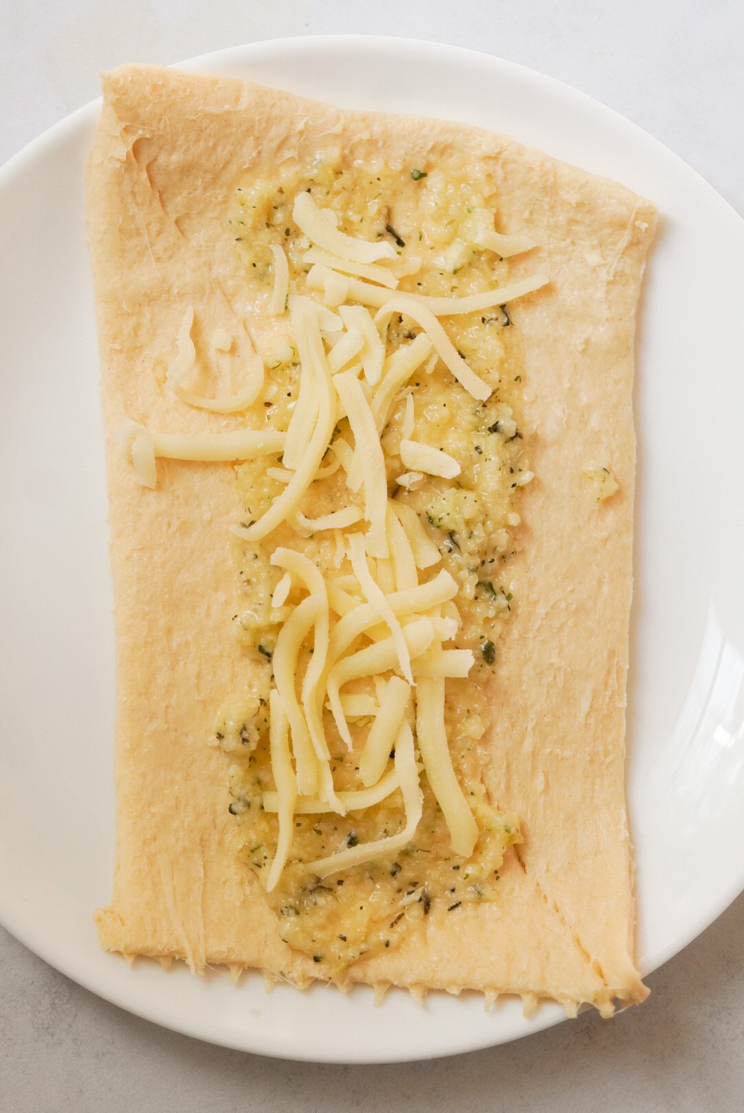 https://wellnessbykay.com/wp-content/uploads/2022/09/crescent-dough-with-garlic-butter-and-parmesan.jpg