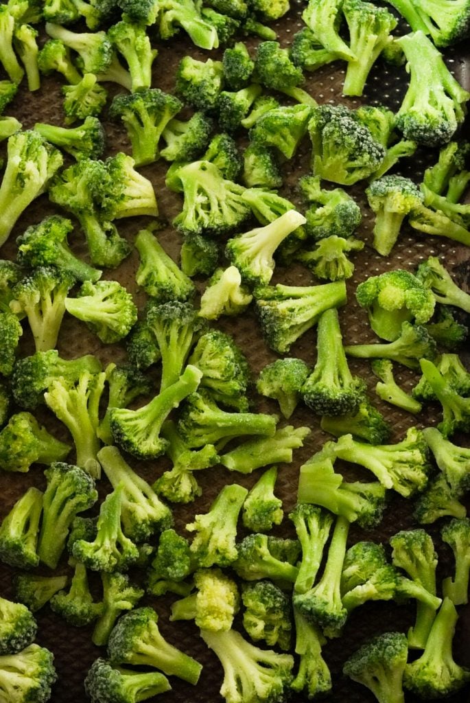 frozen broccoli on a baking sheet