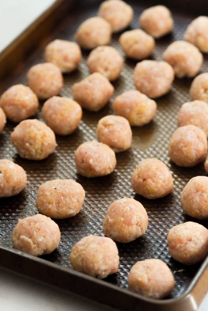 small meatballs on a sheet pan