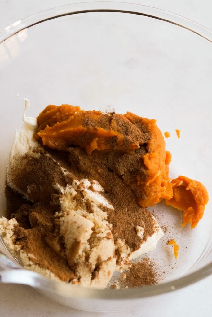 pumpkin, cream cheese, spices, and sugar in a mixing bowl