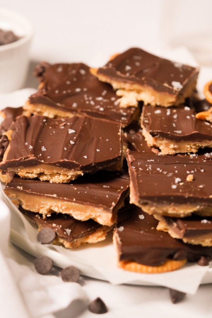 ritz cracker toffee squares layered on a plate