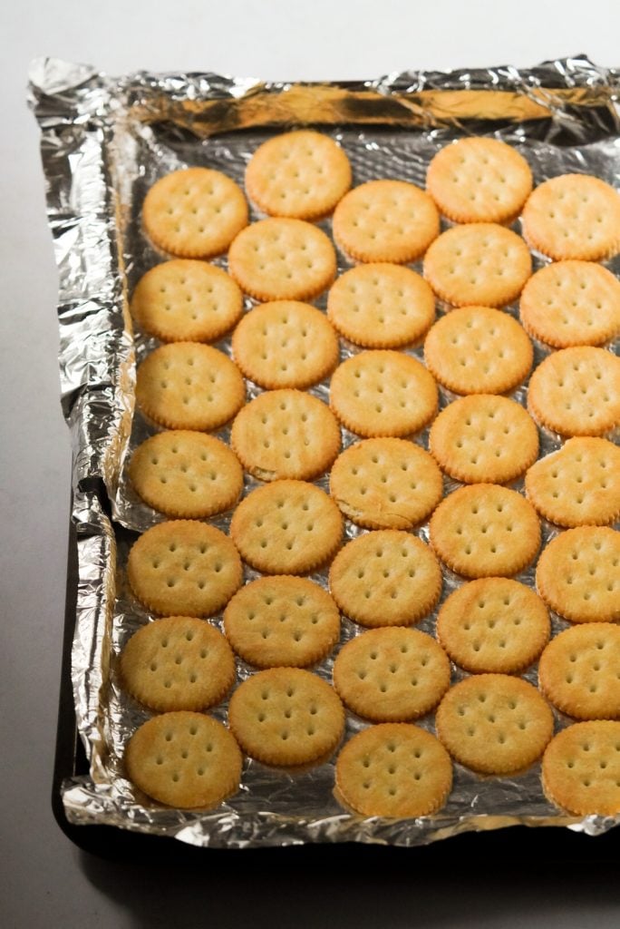 ritz crackers on a cookie sheet