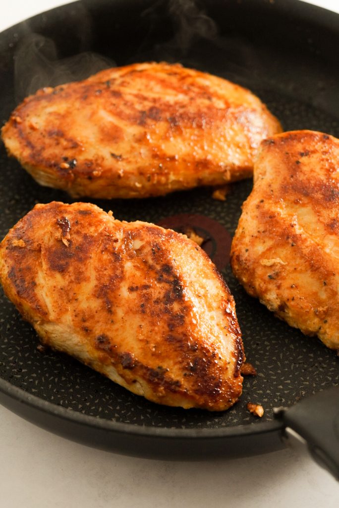 seared chicken breasts in a pan