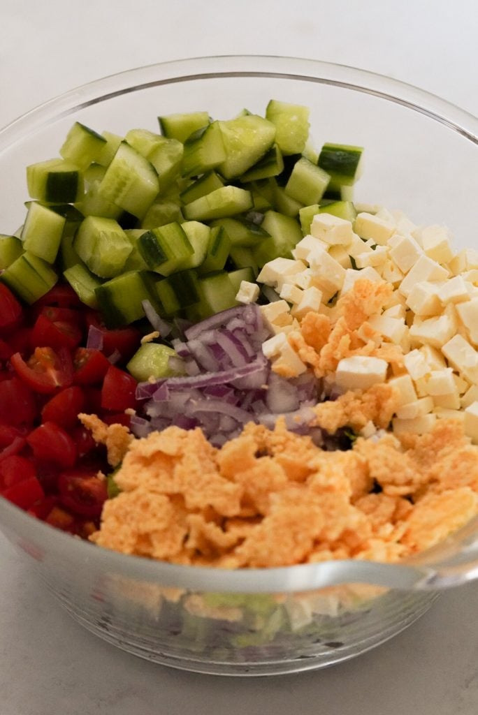 chopped salad ingredients unmixed in large bowl