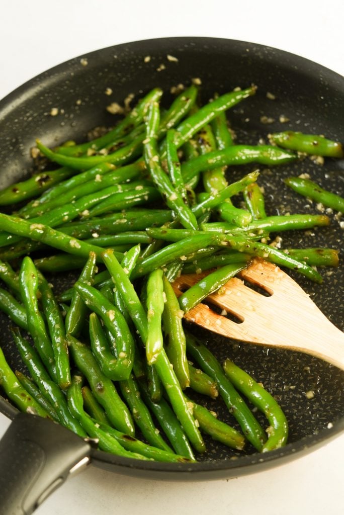 honey garlic green beans in a pan