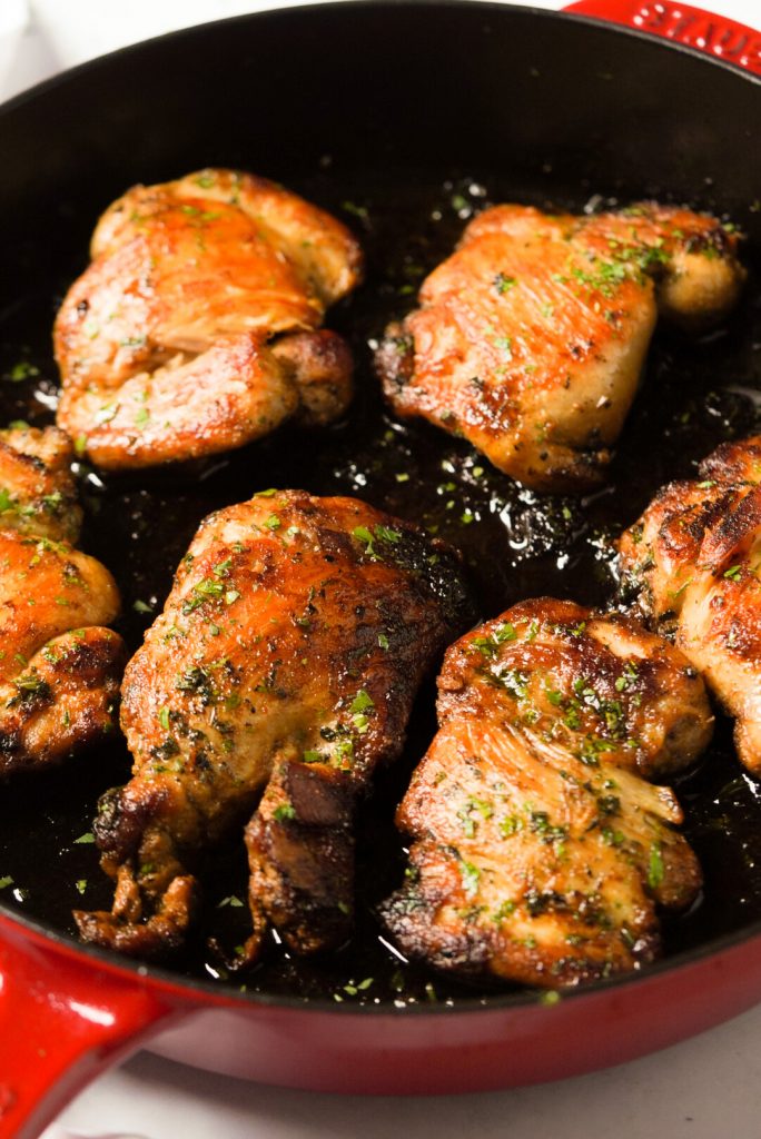 seared chicken thighs in a pan