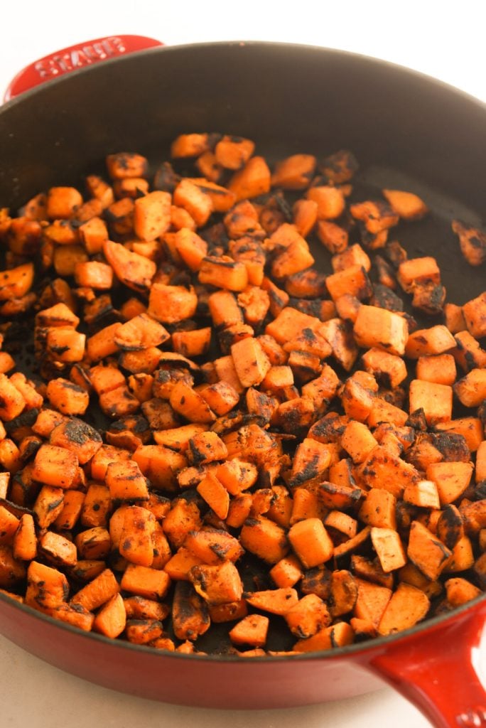 sautéed sweet potatoes in a skillet