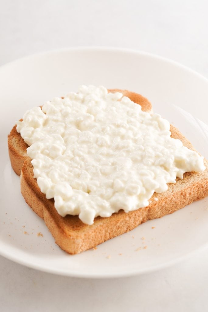 toasted bread with cottage cheese spread on top