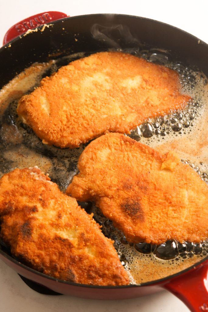 crusted romano chicken in a large skillet