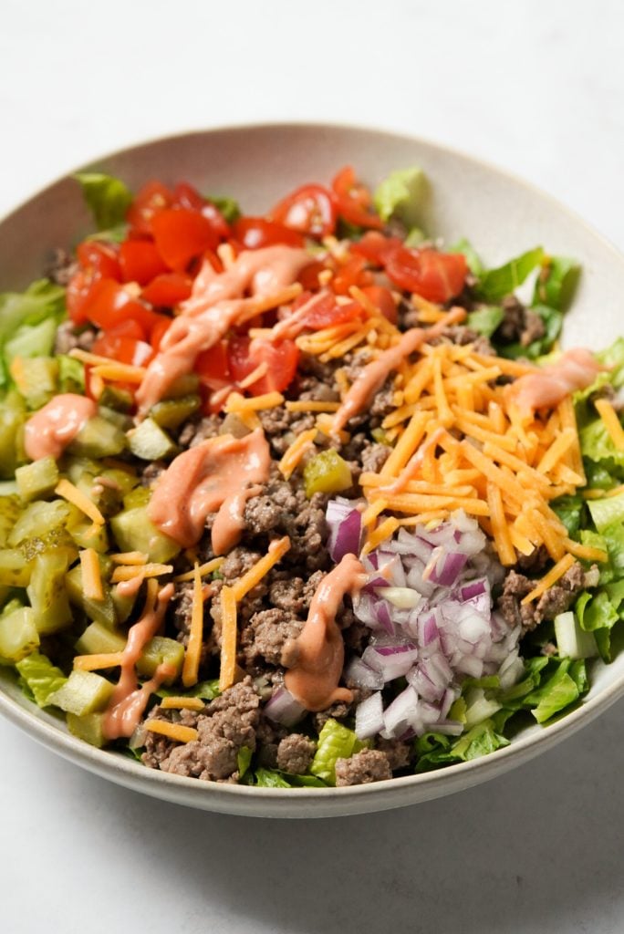 burger salad with special sauce dressing on top