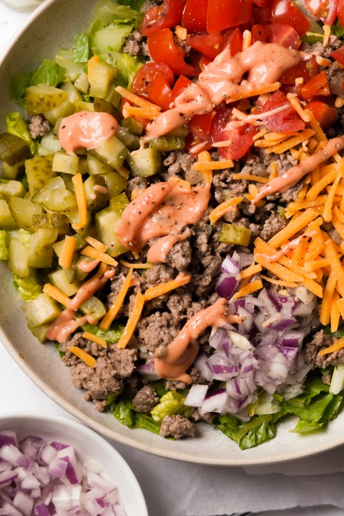 salad with burger meat and burger toppings