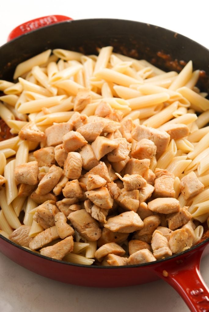 pasta and chicken in a large pan