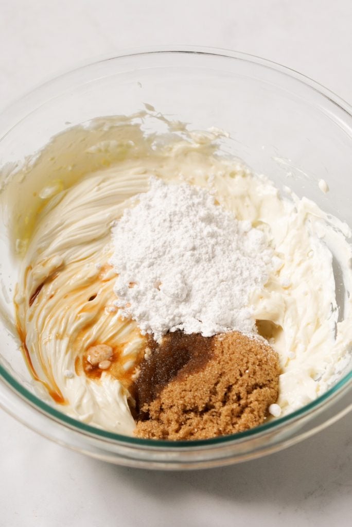 butter, cream cheese, light brown sugar, powdered sugar, and vanilla extract in a mixing bowl