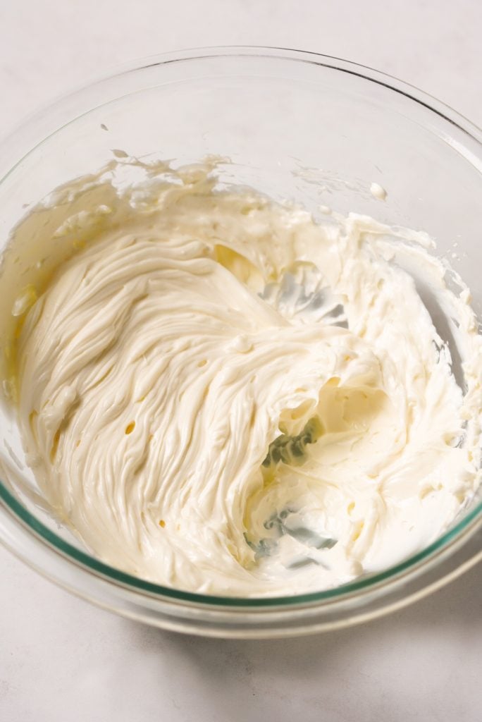 cream cheese and butter creamed together in a mixing bowl