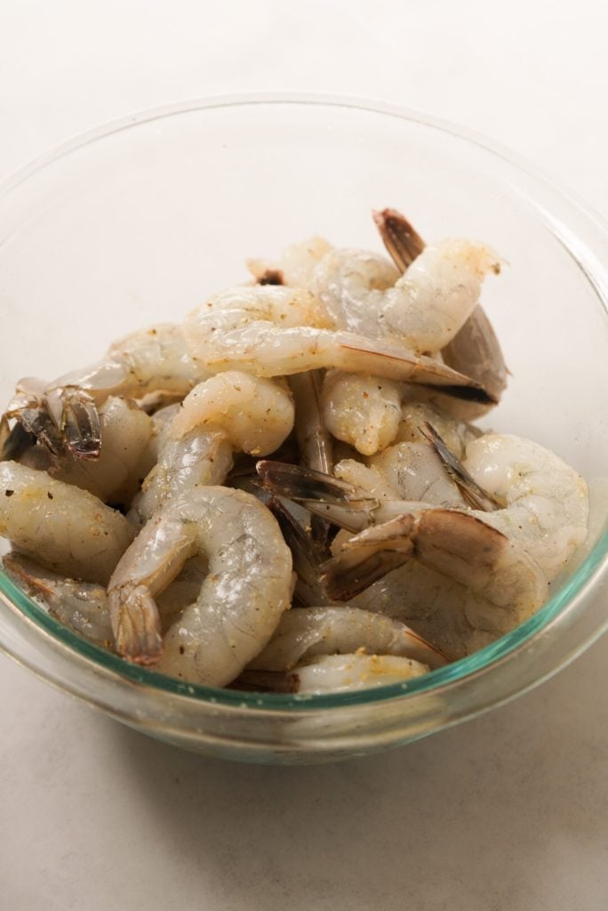 raw shrimp coated in garlic powder, salt, and black pepper
