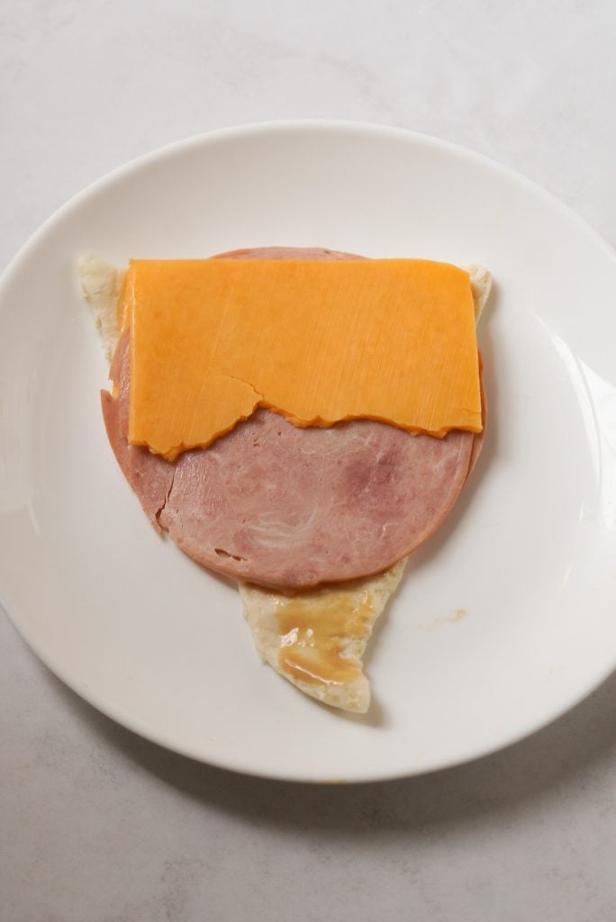 crescent dough triangle with ham, cheese, and honey mustard