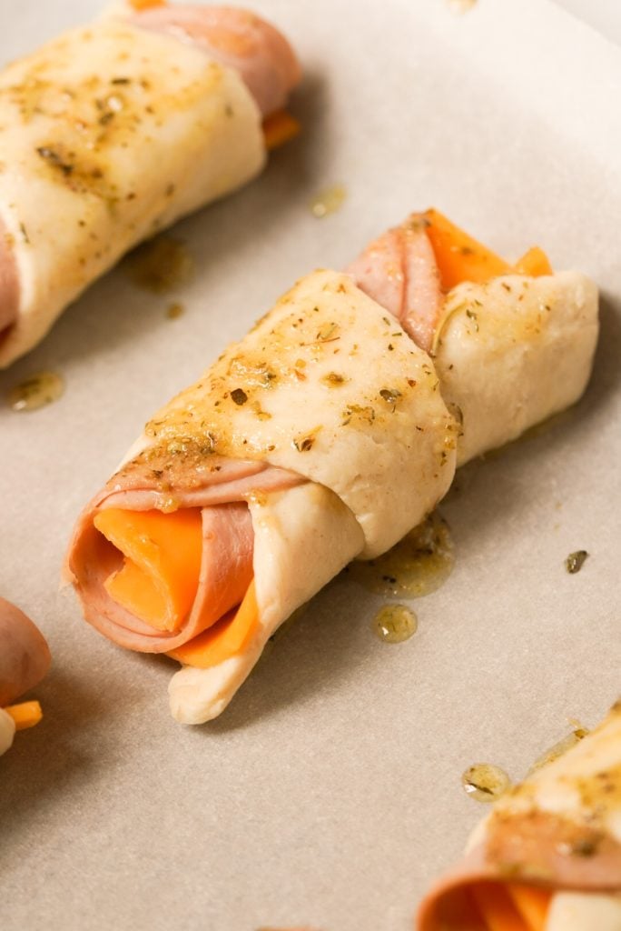 ham and cheese on a crescent roll before baking