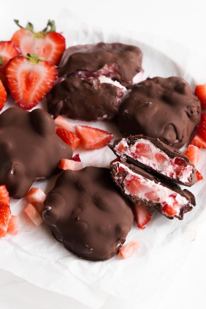 plate of chocolate strawberry cluster with one cut open